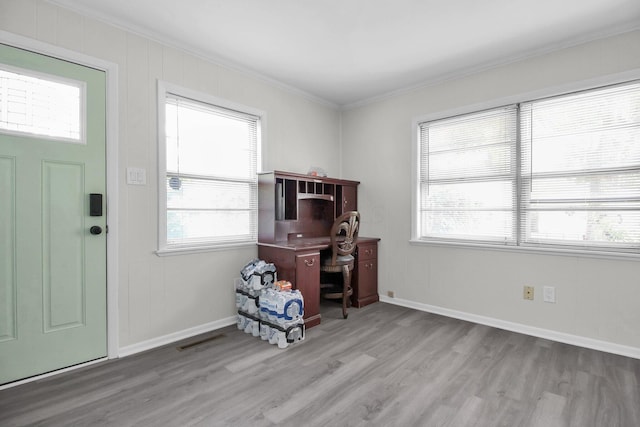 1121 Afton Rd, Columbus, OH 43221 - entrance foyer with crown molding, wood finished floors, and plenty of natural light