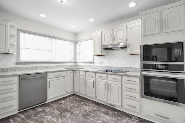 1121 Afton Rd, Columbus, OH 43221 - kitchen with black appliances, under cabinet range hood, dark marble finish floors, white cabinets, and recessed lighting