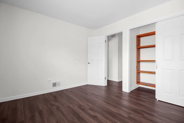 1121 Afton Rd, Columbus, OH 43221 - unfurnished bedroom with dark wood-style floors and baseboards