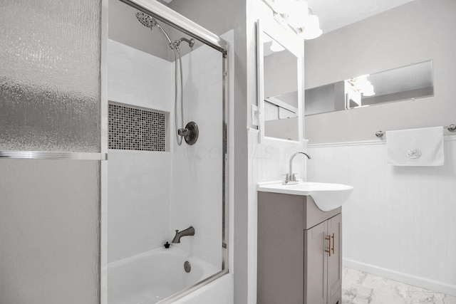 1121 Afton Rd, Columbus, OH 43221 - full bathroom featuring bath / shower combo with glass door, vanity, and marble finish flooring