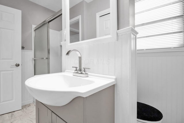 1121 Afton Rd, Columbus, OH 43221 - bathroom with a stall shower, marble finish floors, and vanity