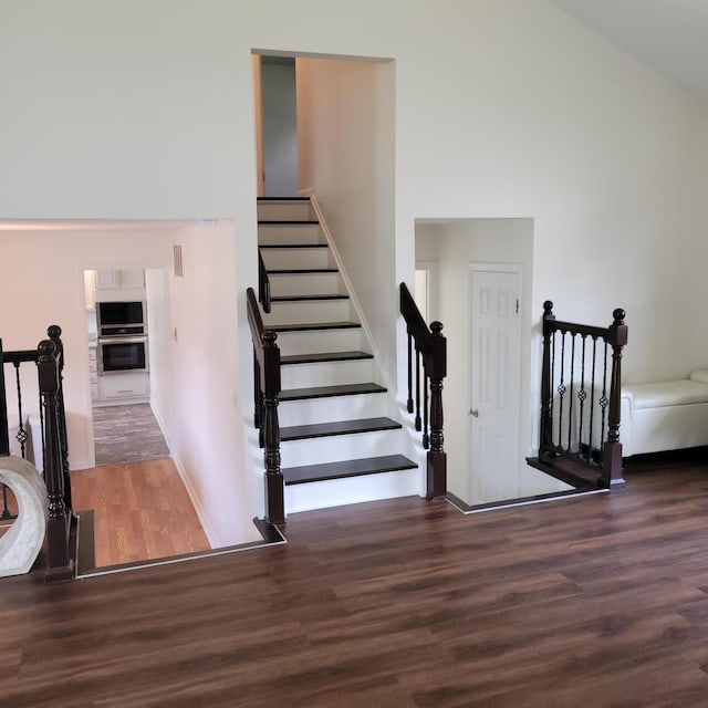 1121 Afton Rd, Columbus, OH 43221 - stairs with wood finished floors and a high ceiling