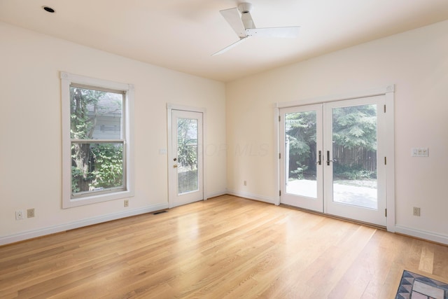 318 Berger Aly, Columbus, OH 43206 - empty room featuring french doors and light wood-style floors