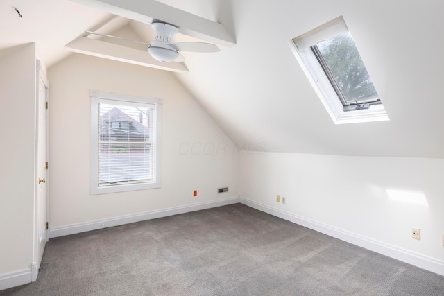 318 Berger Aly, Columbus, OH 43206 - additional living space featuring a skylight, vaulted ceiling, carpet floors, and a ceiling fan