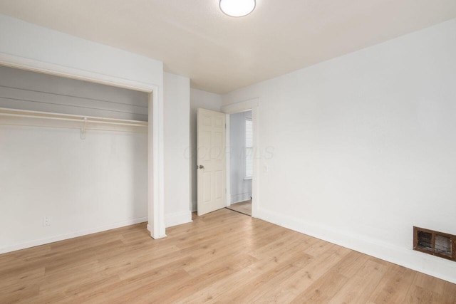 424 S Harris Ave, Columbus, OH 43204 - unfurnished bedroom with light wood-style flooring and a closet