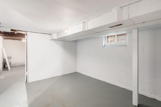 424 S Harris Ave, Columbus, OH 43204 - basement featuring a textured ceiling