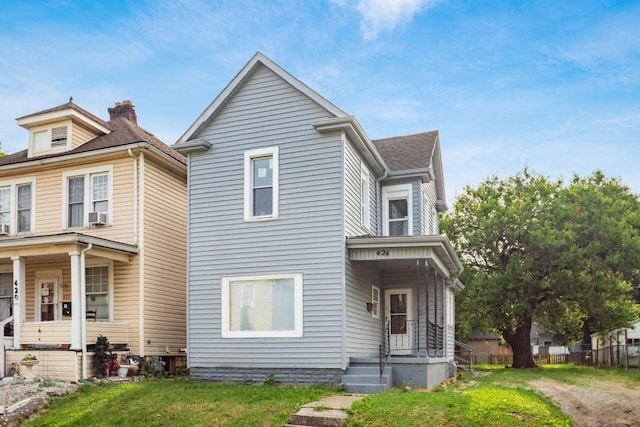 424 S Harris Ave, Columbus, OH 43204 - view of front of home with a front yard, a porch, and roof with shingles