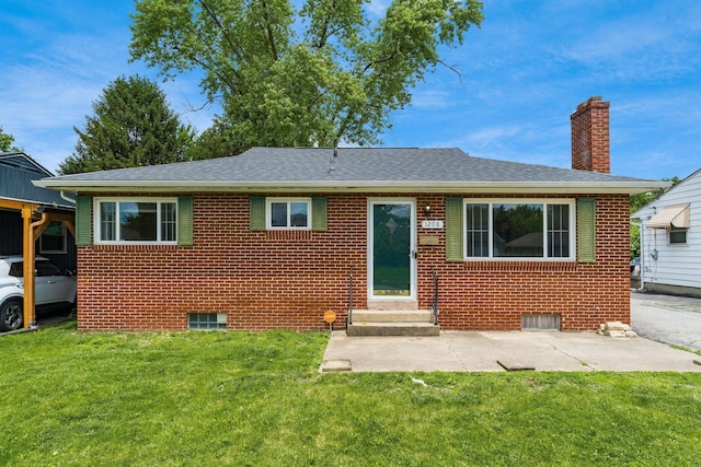 1208 Carolwood Ave, Columbus, OH 43227 - view of front of house with entry steps, a chimney, brick siding, and a front yard