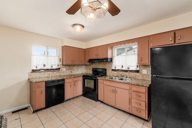 1208 Carolwood Ave, Columbus, OH 43227 - kitchen with black appliances, under cabinet range hood, ceiling fan, tasteful backsplash, and light tile patterned floors