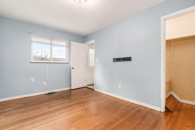 1208 Carolwood Ave, Columbus, OH 43227 - unfurnished bedroom featuring light wood-style flooring and a closet