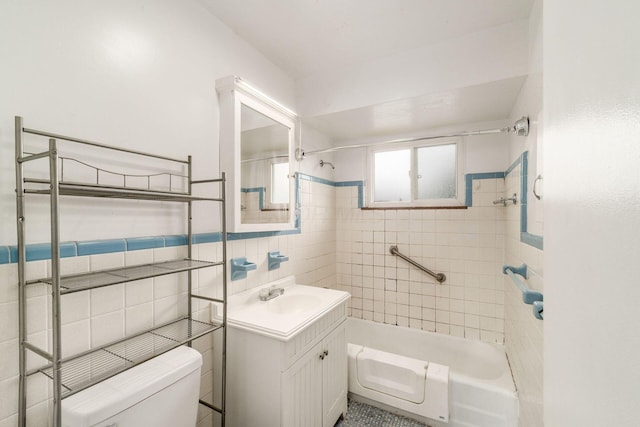 1208 Carolwood Ave, Columbus, OH 43227 - full bath featuring vanity, tub / shower combination, and tile walls