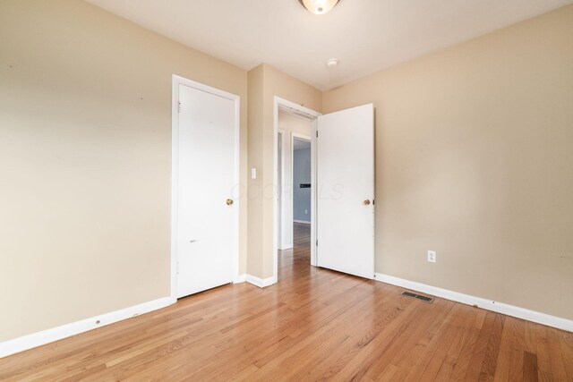 1208 Carolwood Ave, Columbus, OH 43227 - unfurnished bedroom with baseboards and light wood-style flooring
