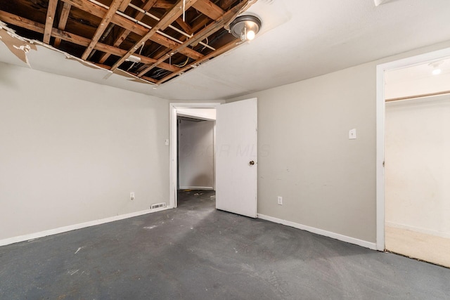 1208 Carolwood Ave, Columbus, OH 43227 - unfurnished bedroom with unfinished concrete flooring and baseboards