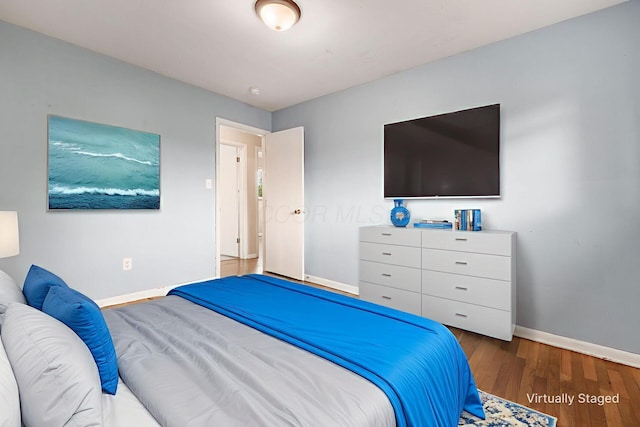 1208 Carolwood Ave, Columbus, OH 43227 - bedroom featuring baseboards and wood finished floors