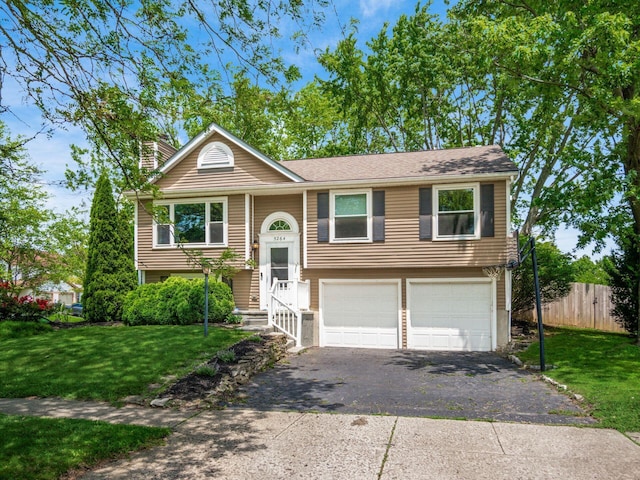 5264 Davidson Rd, Hilliard, OH 43026 - split foyer home with driveway, a garage, and a chimney