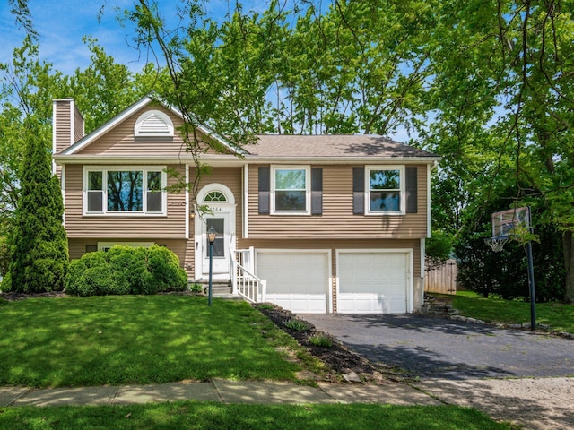 5264 Davidson Rd, Hilliard, OH 43026 - raised ranch with a garage, a chimney, driveway, and a front yard