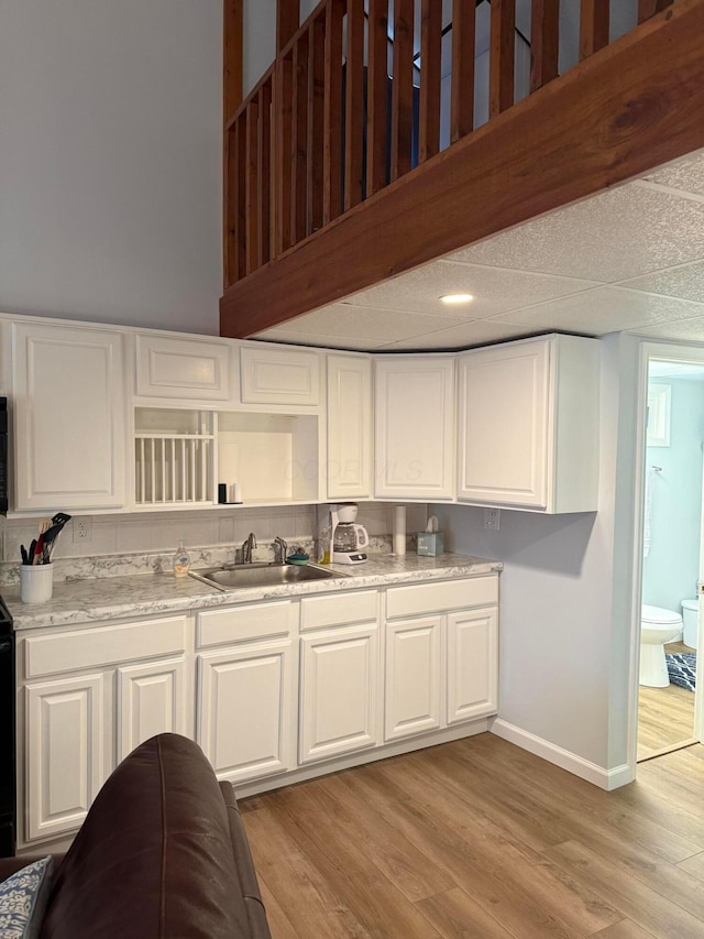 13997 Custers Point Rd NE, Thornville, OH 43076 - kitchen with white cabinets, light wood-style floors, and light countertops