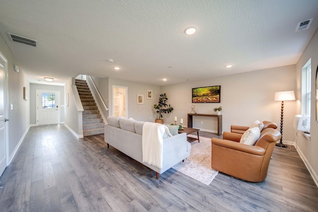 66 Genoa Cir, Commercial Point, OH 43116 - living room featuring stairway, wood finished floors, recessed lighting, and a textured ceiling