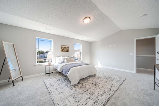66 Genoa Cir, Commercial Point, OH 43116 - bedroom featuring light colored carpet, vaulted ceiling, and a textured ceiling