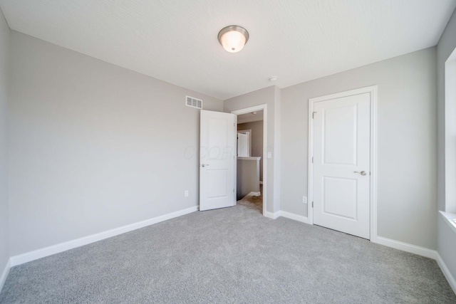 66 Genoa Cir, Commercial Point, OH 43116 - unfurnished bedroom with carpet flooring