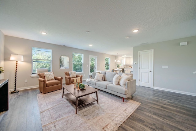66 Genoa Cir, Commercial Point, OH 43116 - living room with dark wood-style flooring, recessed lighting, and a chandelier