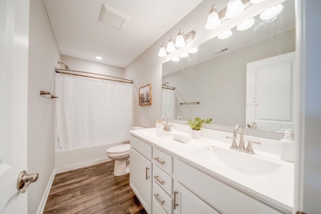 66 Genoa Cir, Commercial Point, OH 43116 - full bath with double vanity, wood finished floors, and shower / tub combo with curtain