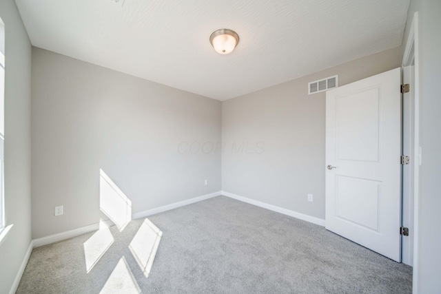 66 Genoa Cir, Commercial Point, OH 43116 - carpeted empty room with baseboards