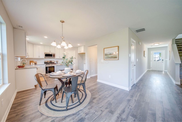 66 Genoa Cir, Commercial Point, OH 43116 - dining room with a chandelier, wood finished floors, and recessed lighting