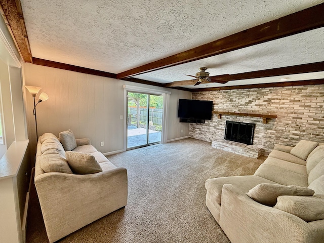 1724 Ramblewood Ave, Columbus, OH 43235 - carpeted living room featuring ceiling fan, a textured ceiling, beam ceiling, and a brick fireplace
