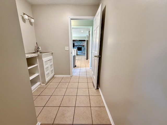 1724 Ramblewood Ave, Columbus, OH 43235 - hallway with light tile patterned floors and a textured ceiling