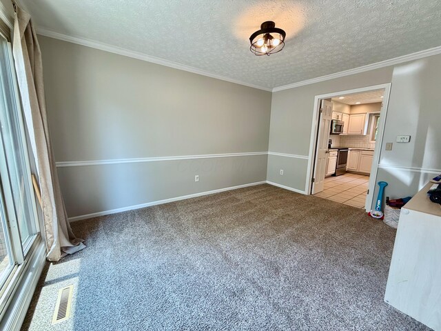 1724 Ramblewood Ave, Columbus, OH 43235 - empty room featuring light carpet, a textured ceiling, and crown molding