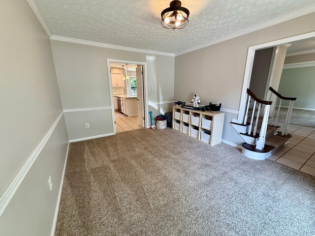1724 Ramblewood Ave, Columbus, OH 43235 - unfurnished room featuring stairs, carpet floors, tile patterned flooring, a textured ceiling, and crown molding