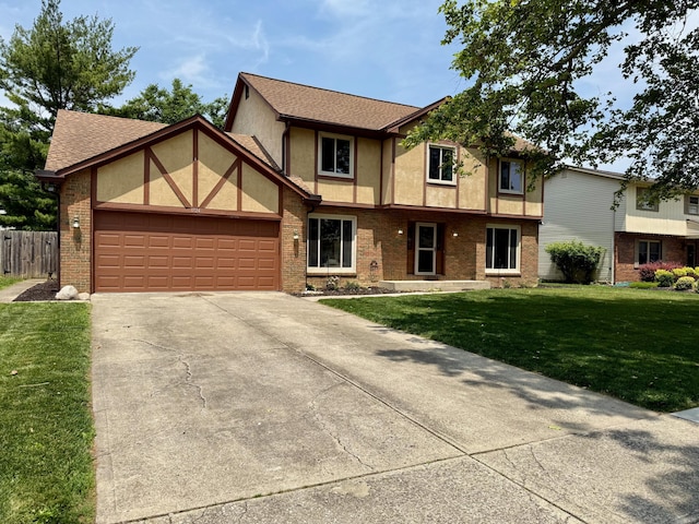 1724 Ramblewood Ave, Columbus, OH 43235 - english style home featuring a garage, concrete driveway, brick siding, and stucco siding