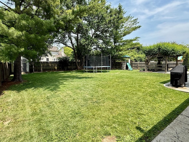 1724 Ramblewood Ave, Columbus, OH 43235 - fenced backyard with a trampoline, a playground, and a shed
