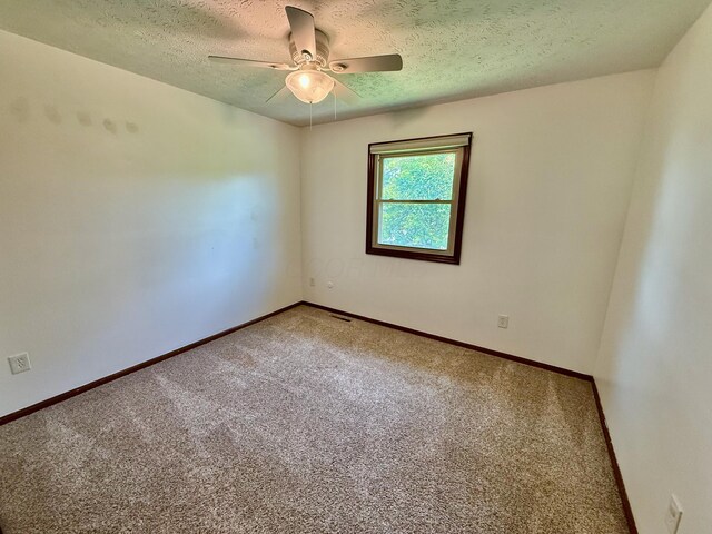 1724 Ramblewood Ave, Columbus, OH 43235 - carpeted empty room featuring a textured ceiling and a ceiling fan
