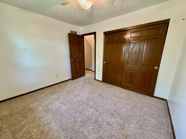 1724 Ramblewood Ave, Columbus, OH 43235 - unfurnished bedroom featuring light carpet, a textured ceiling, a ceiling fan, and a closet