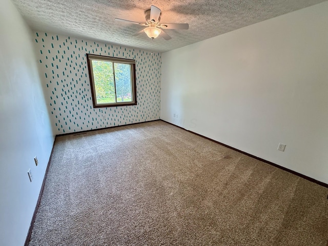 1724 Ramblewood Ave, Columbus, OH 43235 - empty room with a textured ceiling, a ceiling fan, wallpapered walls, carpet, and an accent wall