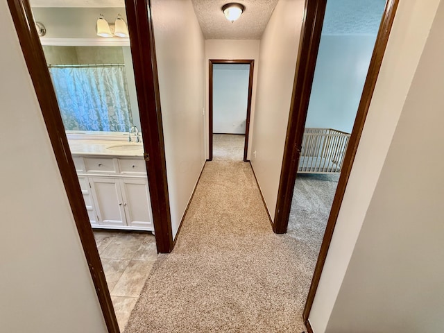 1724 Ramblewood Ave, Columbus, OH 43235 - corridor with a textured ceiling and light colored carpet