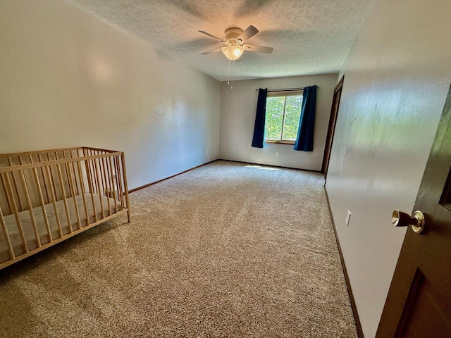 1724 Ramblewood Ave, Columbus, OH 43235 - unfurnished bedroom with carpet flooring, a textured ceiling, ceiling fan, and a nursery area