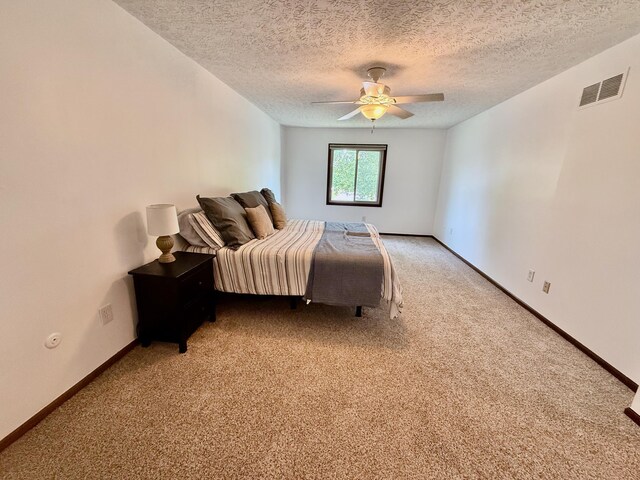 1724 Ramblewood Ave, Columbus, OH 43235 - bedroom with light colored carpet, a textured ceiling, and ceiling fan
