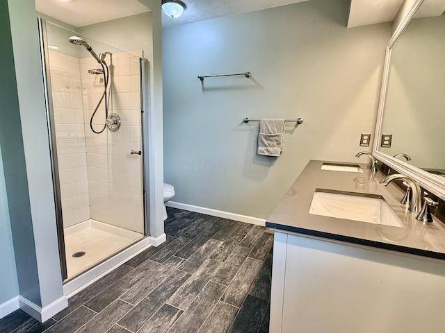 1724 Ramblewood Ave, Columbus, OH 43235 - bathroom featuring a stall shower, double vanity, and wood finish floors