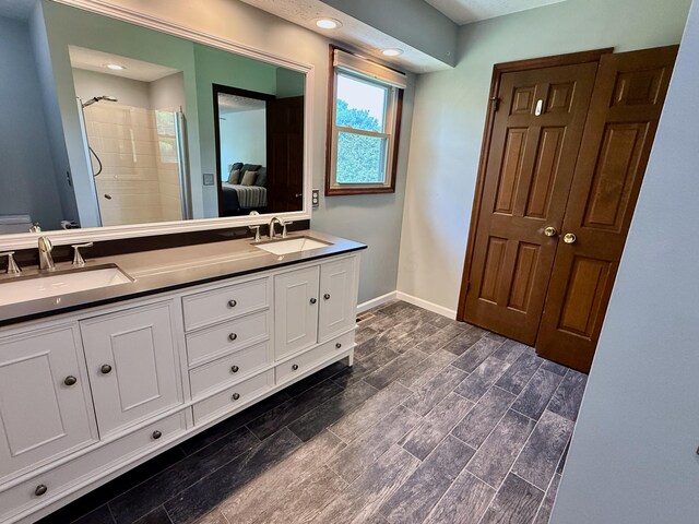 1724 Ramblewood Ave, Columbus, OH 43235 - full bathroom with double vanity, tiled shower, and recessed lighting
