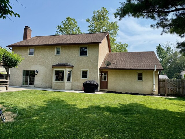 1724 Ramblewood Ave, Columbus, OH 43235 - back of house featuring a chimney, stucco siding, a patio area, and a shingled roof