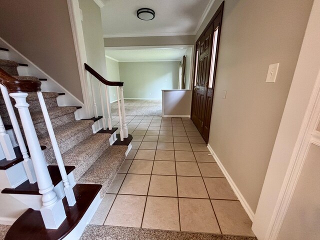 1724 Ramblewood Ave, Columbus, OH 43235 - corridor featuring ornamental molding, stairs, and light tile patterned flooring