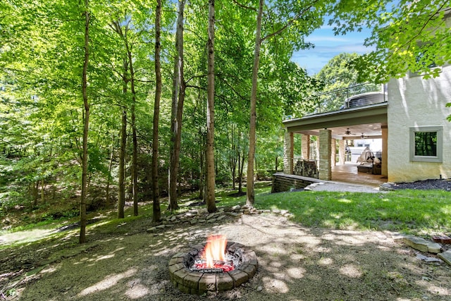 1967 Woodlands Pl, Powell, OH 43065 - view of yard featuring a fire pit, ceiling fan, and a patio