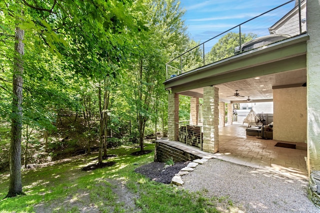 1967 Woodlands Pl, Powell, OH 43065 - view of yard featuring a ceiling fan and a patio area