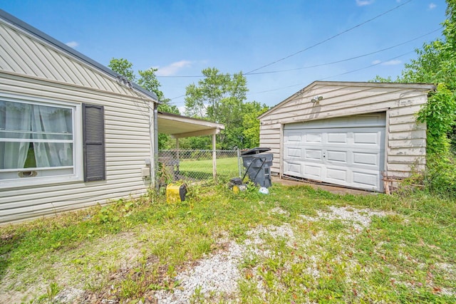136 Ridgeview Ct, Johnstown, OH 43031 - view of yard featuring a garage, an outbuilding, and driveway