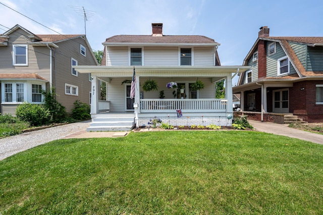 297 Central Ave, Newark, OH 43055 - view of front of property featuring covered porch, a front yard, and a chimney