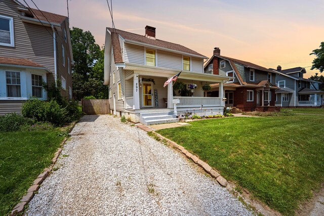 297 Central Ave, Newark, OH 43055 - view of front of property with driveway, covered porch, and a chimney