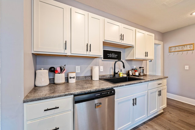 297 Central Ave, Newark, OH 43055 - kitchen with dishwasher, dark countertops, wood finished floors, and white cabinets